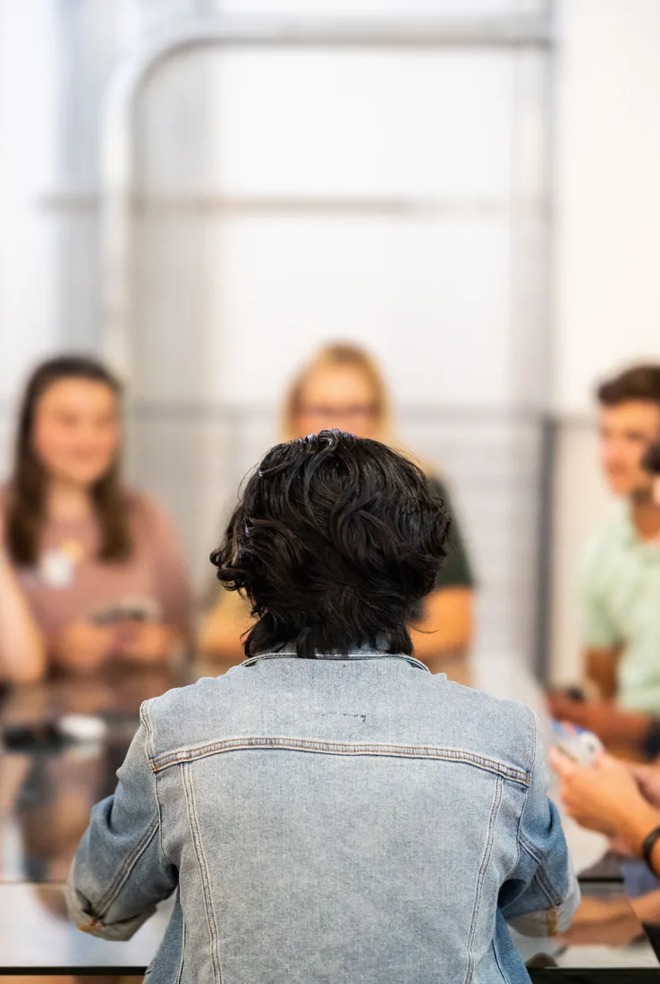People sharing ideas in a group discussion